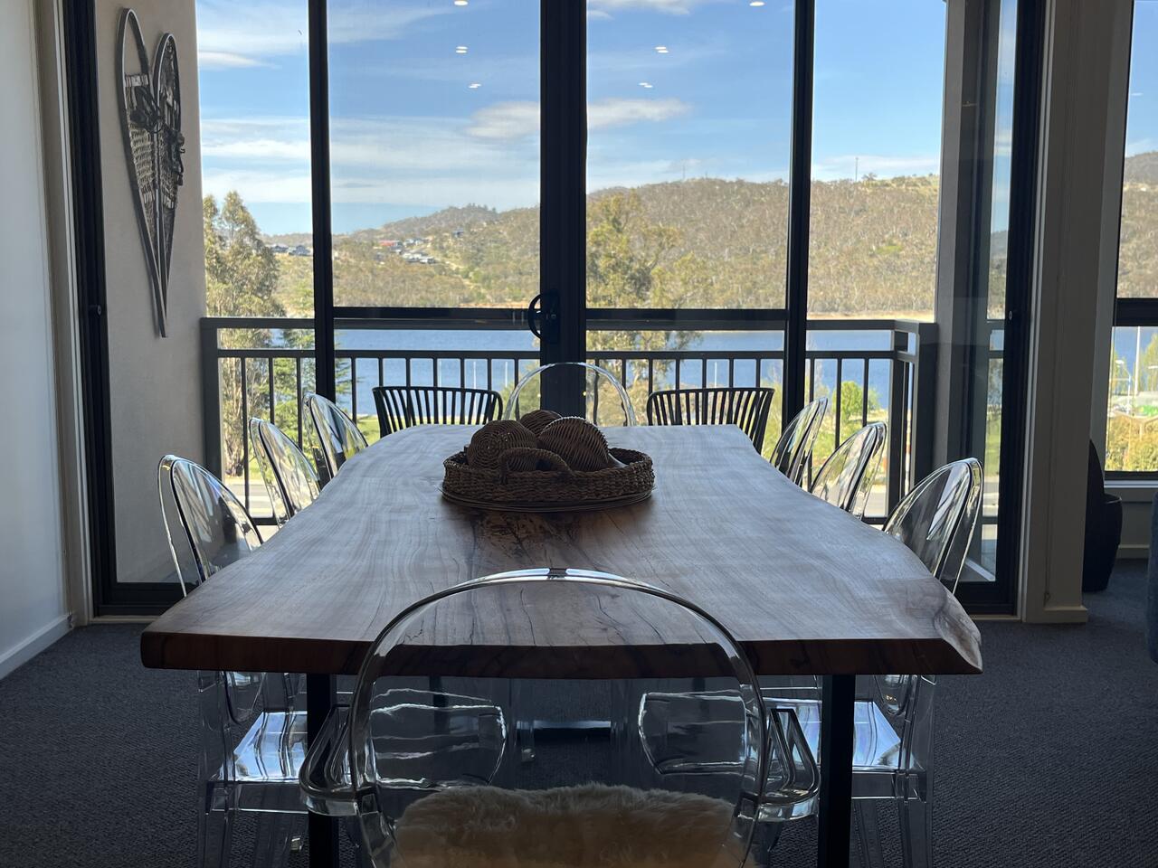 Dining table by the window with lake view