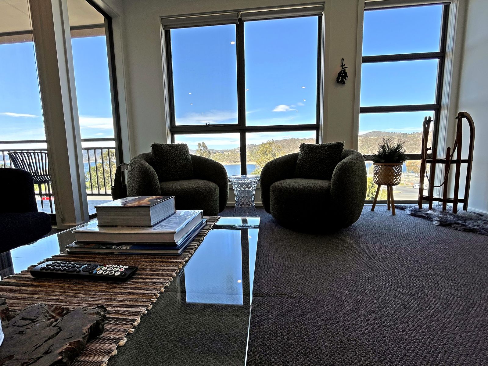 Armchairs and coffee table by the windows